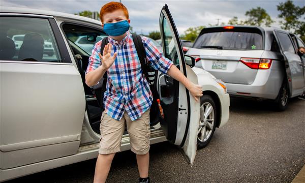 student gets out of car